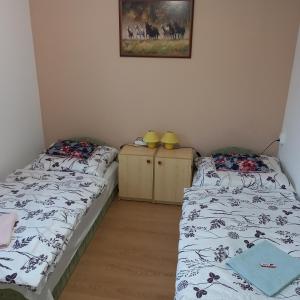 Кровать или кровати в номере Jucus Vendégház