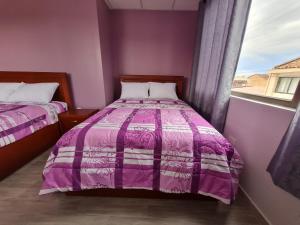 Postel nebo postele na pokoji v ubytování Hostal Morlaquita