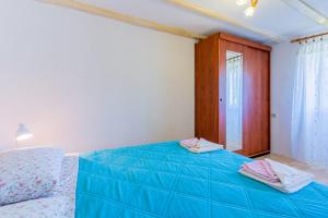 Кровать или кровати в номере Apartmani Valun1