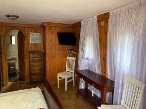 TV a/nebo společenská místnost v ubytování Bonito apartamento villa Joya