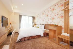 TV a/nebo společenská místnost v ubytování NAGAHIRO Hotel