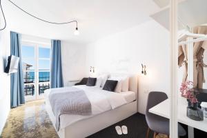 Postel nebo postele na pokoji v ubytování Art Hotel Tartini
