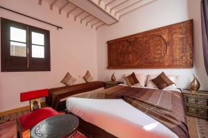 Tempat tidur dalam kamar di Dar Halima
