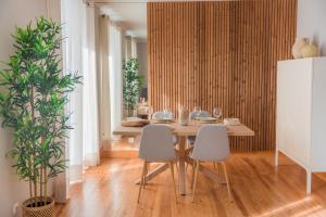 a dining room with a table and two chairs at Chic & Classy Lisboa by GT House in Lisbon