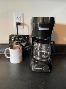 a coffee maker sitting on top of a counter at Mountain View Motel in Smithers