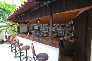 a bar with a bunch of chairs and a counter at Hotel Anastasia in Rhodes Town