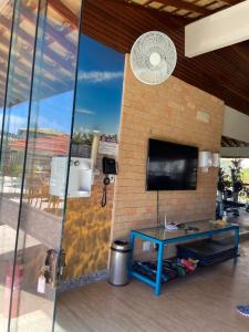 TV a/nebo společenská místnost v ubytování Residencial Ykutiba