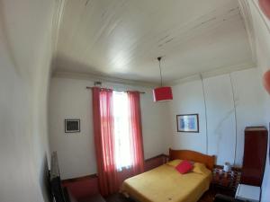 Postel nebo postele na pokoji v ubytování Hostal Tres casas