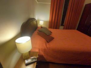Postel nebo postele na pokoji v ubytování Hostal Tres casas