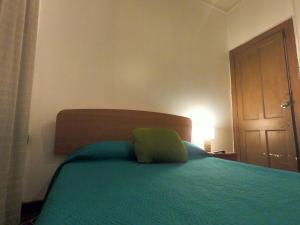 Postel nebo postele na pokoji v ubytování Hostal Tres casas