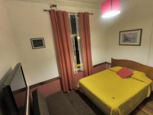 Postel nebo postele na pokoji v ubytování Hostal Tres casas