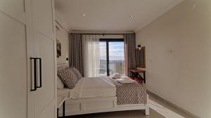 A bed or beds in a room at KAAN VILLA