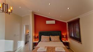 A bed or beds in a room at KAAN VILLA
