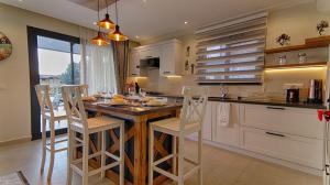 A kitchen or kitchenette at KAAN VILLA