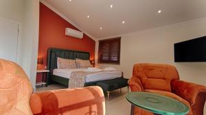 A bed or beds in a room at KAAN VILLA