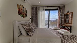 A bed or beds in a room at KAAN VILLA