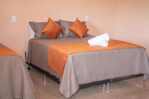 Tempat tidur dalam kamar di Chalés Cantin da Serra - Serra da Canastra/MG