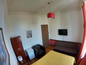 TV a/nebo společenská místnost v ubytování Hostal Tres casas