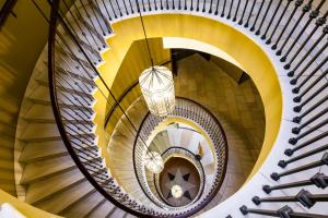 a spiral staircase in a building at RL Ciudad de Úbeda in Úbeda