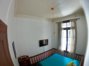 TV a/nebo společenská místnost v ubytování Hostal Tres casas