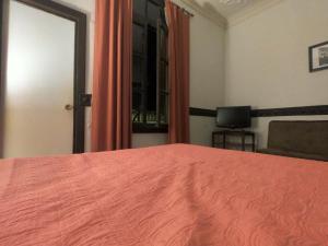 Postel nebo postele na pokoji v ubytování Hostal Tres casas