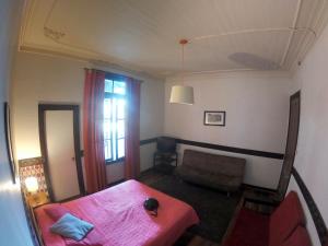 Postel nebo postele na pokoji v ubytování Hostal Tres casas