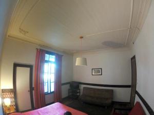 Postel nebo postele na pokoji v ubytování Hostal Tres casas