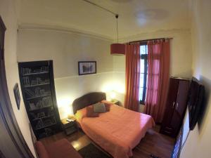 Postel nebo postele na pokoji v ubytování Hostal Tres casas