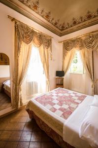 Postel nebo postele na pokoji v ubytování Hotel Iris