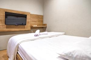 Voodi või voodid majutusasutuse Three J Residence 2 toas