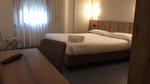 Postel nebo postele na pokoji v ubytování Hotel Doria - Business & Bike