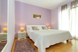 Posteľ alebo postele v izbe v ubytovaní Exclusive Center Apartments