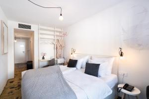 Postel nebo postele na pokoji v ubytování Art Hotel Tartini