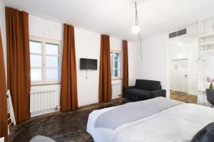 Postel nebo postele na pokoji v ubytování Art Hotel Tartini