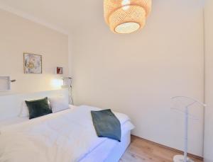 Łóżko lub łóżka w pokoju w obiekcie Perfect for Families and Mid-Term-Stays
