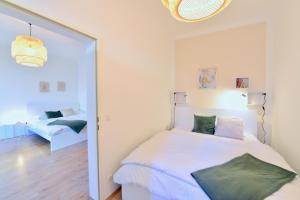 Łóżko lub łóżka w pokoju w obiekcie Perfect for Families and Mid-Term-Stays