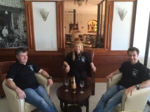 a group of three people sitting in chairs at Hotel La Regence in Villefranche-sur-Mer