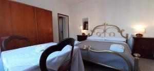 Postel nebo postele na pokoji v ubytování BeeLiving Room&Breakfast