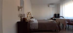 Postel nebo postele na pokoji v ubytování BeeLiving Room&Breakfast