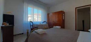 Postel nebo postele na pokoji v ubytování BeeLiving Room&Breakfast