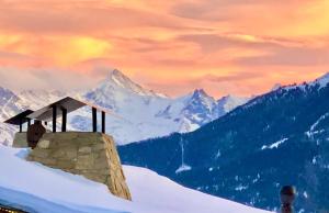 a painting of a building on top of a snow covered mountain at Hautes Roches - Magnifique vue sur la montagne in Crans-Montana