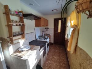 an overhead view of a kitchen with a stove at Domek Gajowego in Ropienka