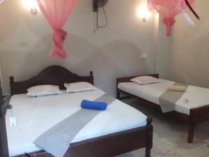 Katil atau katil-katil dalam bilik di Mila Rest Garden