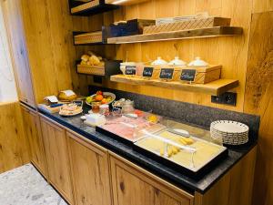 a kitchen with a buffet with food on a counter at Wengerbauer in Dorfgastein