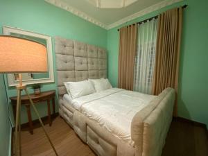Una cama o camas en una habitación de Namu Homestay