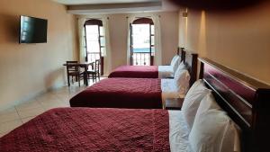 Postel nebo postele na pokoji v ubytování Suites Del Risco
