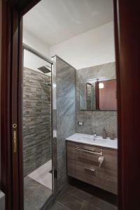 a bathroom with a shower and a sink at Casa Ceragioli in Viareggio