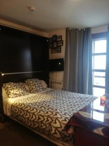 a bedroom with a bed and a glass table at APARTAMENTO LOS VALLES en SIERRA NEVADA Parking gratuito in Sierra Nevada