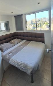 Кровать или кровати в номере Sea View Apartment