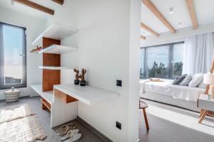 A bed or beds in a room at Luxury Villa Terra Promessa - Paxos